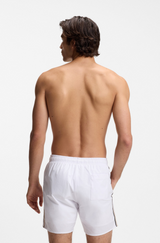 Swim shorts with signature stripe and logo