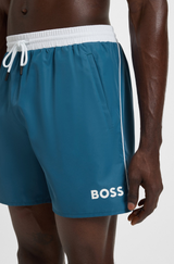 Swim shorts with contrast logo and piping