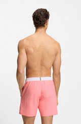 Swim shorts with contrast logo and piping
