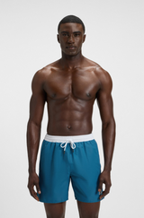 Swim shorts with contrast logo and piping