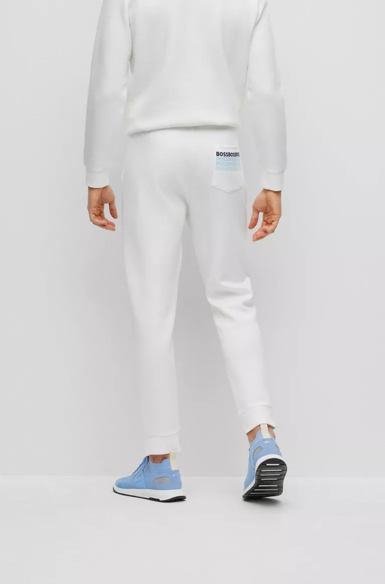 BOSS REGULAR-FIT TRACKSUIT BOTTOMS WITH MULTI-COLOURED LOGOS IN WHITE
