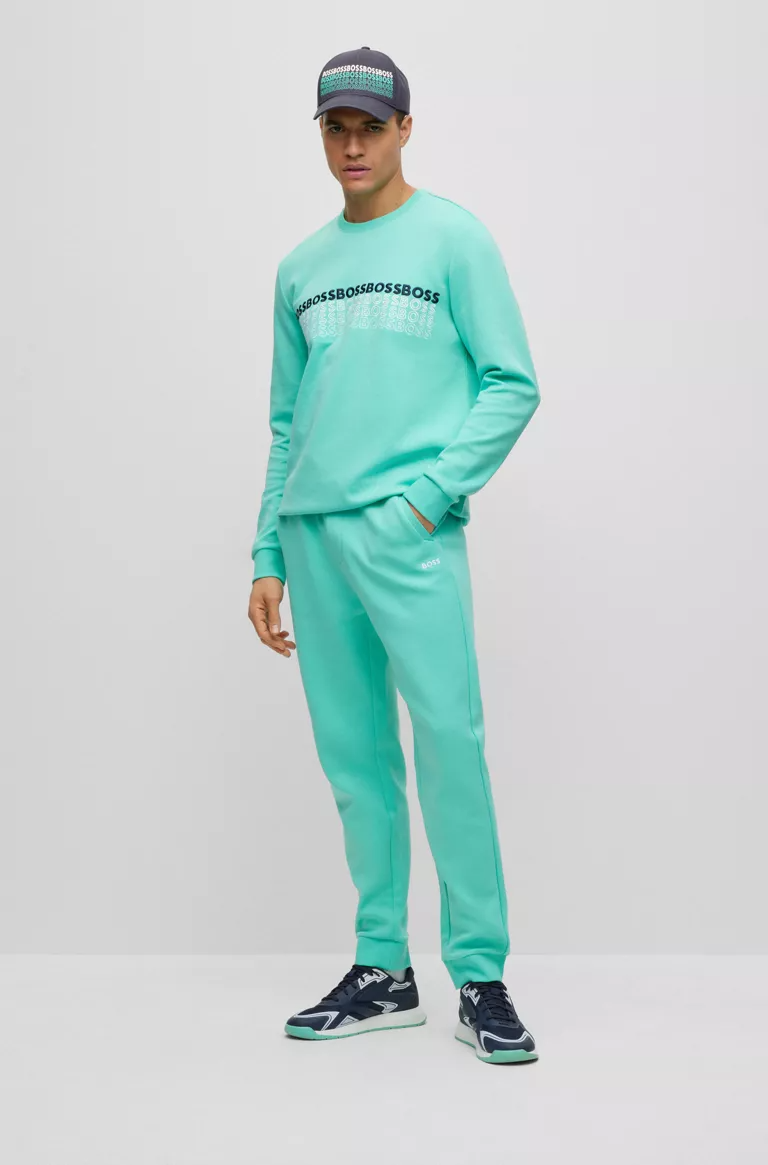 BOSS REGULAR-FIT TRACKSUIT BOTTOMS WITH MULTI-COLOURED LOGOS IN TURQUOISE