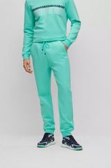 BOSS REGULAR-FIT TRACKSUIT BOTTOMS WITH MULTI-COLOURED LOGOS IN TURQUOISE
